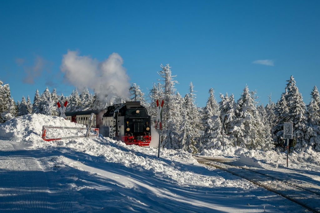 pexels-photo-30607253-30607253 A vintage steam train travels through a snowy forest in Wernigerode, Germany.